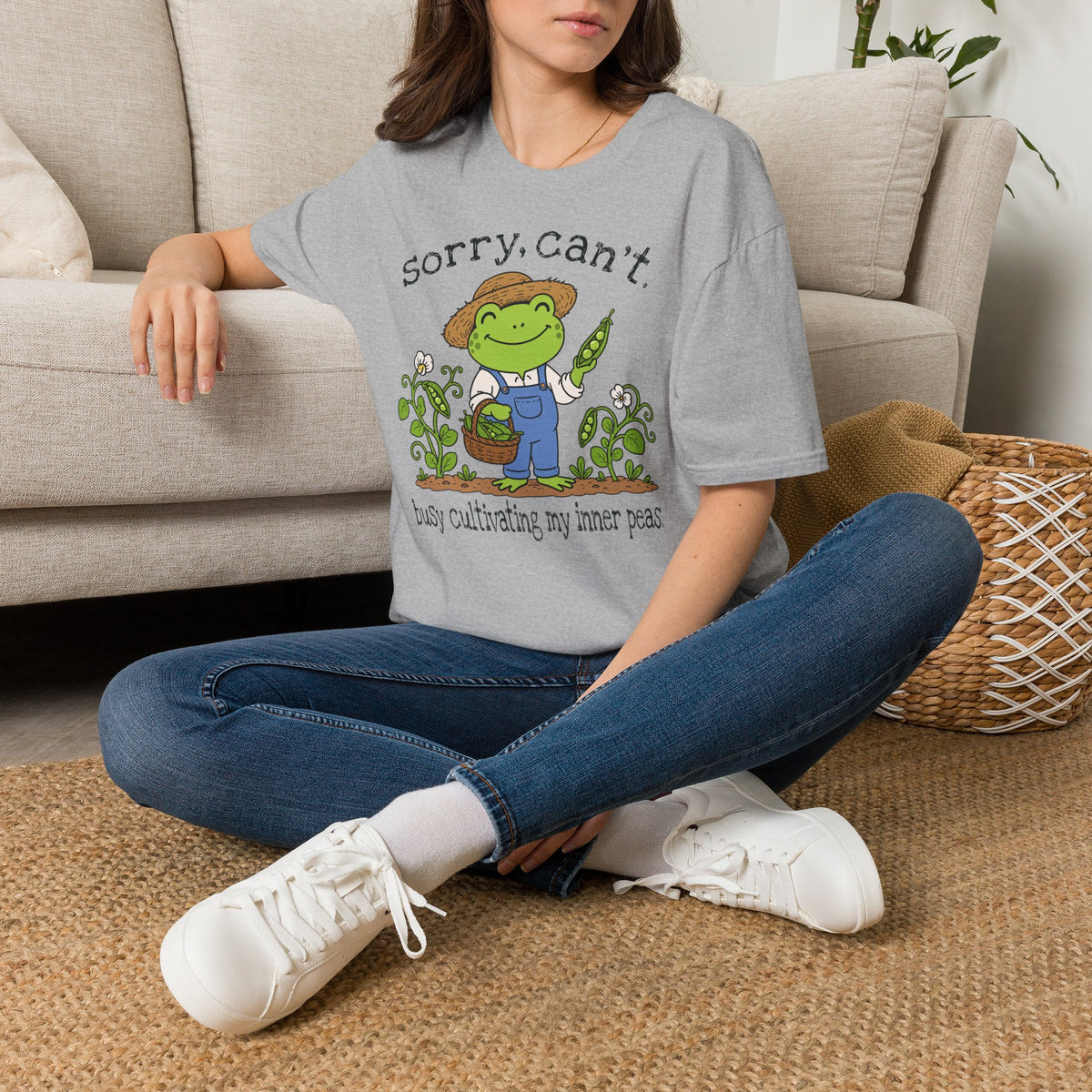 Lifestyle mockup of the Sorry Can't Busy Cultivating My Inner Peas Frog Gildan 64000 T-shirt.