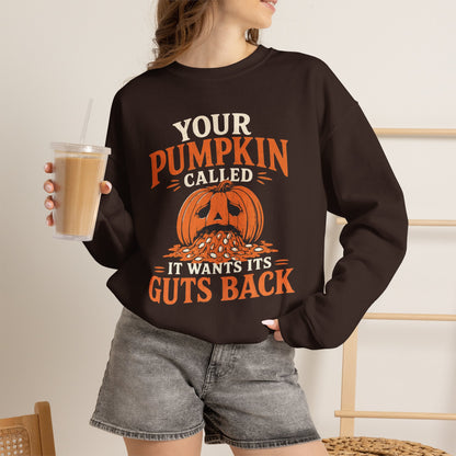 Lifestyle mockup of the Your Pumpkin Called It Wants Its Guts Back Gildan 18000 sweatshirt.